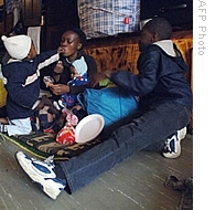 A refugee family from Zimbabwe sit together in the Central Methodist Church in Johannesburg, 30 Jun 2008