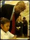 Secretary Paige reads along with Breanna Evans, 2nd grade student, during his tour of W. Claude Hudnall Elementary in Inglewood, CA, on January 31.  Hudnall marks the Secretary's first school visit of 2003.