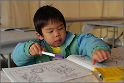 Photo of a student at a desk.