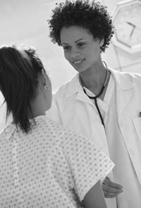 Photo of female doctor with female patient.