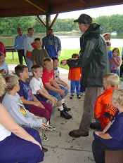 Biologist Nick Starzl describing the characteristics which make lake sturgeon unique during the 2008 Blackhawk Park Kid's Fishing Day.  fws photo  