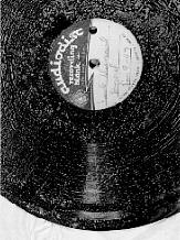 Acetate on aluminum disc recording showing the dusty white extrusion of the plastic softeners.