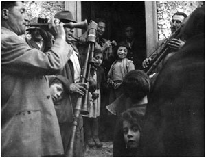 Musicians playing in the street, Caffiano, Campania, 1955. Photo by Alan Lomax.