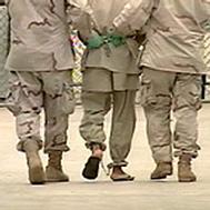 A detainee at Guantanamo Bay, Cuba being escorted by two U.S. soldiers (file photo)
