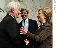 Secretary of State-designate Sen. Hillary Rodham Clinton, right, is greeted by Senate Foreign Relations Committee members Sen. Christopher Dodd, Sen. John Kerry, prior to start of hearing, 13 Jan 2009