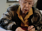 Photo of elderly woman doing forms