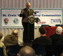 Photo shows former Vice President Walter Mondale speaking to an audience with St. Croix Valley banner behind him. Photo courtesy Randy Thoreson.