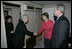 As President Bush looks on, Mrs. Laura Bush shakes hands with Japanese Ambassador to the United States Ryozo Kato and his wife, Hanayo, as the couple greeted the President and First Lady upon their arrival Tuesday, Nov. 15, 2005, to Osaka International Airport. 