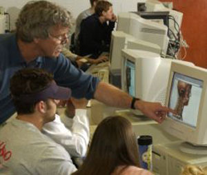 Virtually human anatomy -- Dr. Mark Frasier works with students in the computer lab portion of gross anatomy.