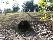 A new, larger culvert was installed below the streambed to improve fish passage. 