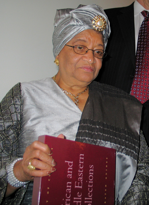 Liberian President Ellen Sirleaf Jones holds the Library's illustrated guide to African and Middle Eastern collections.