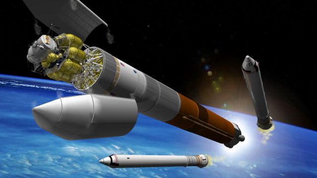 An artist’s rendition of NASA’s planned heavy-lift rocket orbiting Earth.  Solid rocket boosters have just been ejected and the front of the rocket is opening up to reveal a lunar lander inside. 