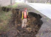 Damage on Oregon 202 along the shoulder of the road.