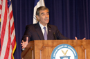 Secretary Carlos Gutierrez at podium