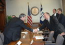 Secretary Gutierrez  shakes hands with Governor