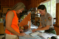 Ranger helping a visitor at the Exit Glacier Nature Center