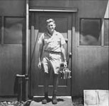 Harold Agnew holding the Nagasaki bomb core, Tinian Island, August 1945