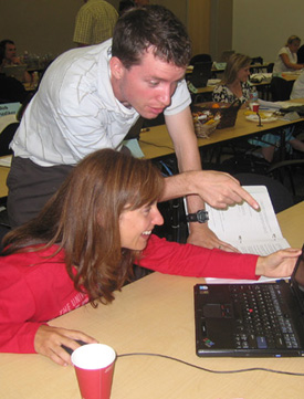 man and woman at laptop computer