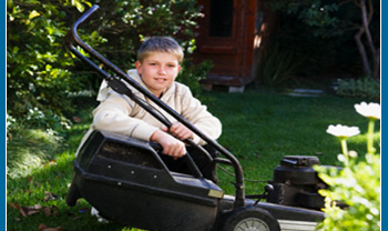 Teen worker fixing lawn mower