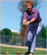 older woman playing bocce