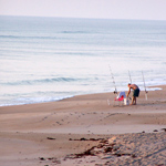 Man fishing in the early morning along a secluded section of Playalinda Beach