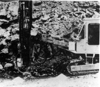 Figure 5. Drilling of rock containing crystalline silica during highway construction