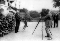 President Warren Harding with his dog Laddie, being photographed in front of the White House, June 13, 1922.