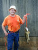 Man in orange shirt with fish