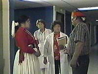 Medicine man with nurse and Navajo woman