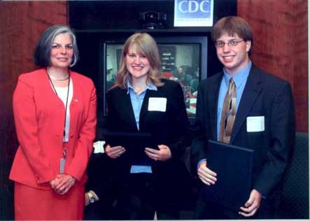 2003 Disease Detectives event winners from Michigan’s Grand Haven High School, receive awards from CDC Director Dr. Julie L. Gerberding. 