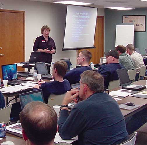 Angela Rieck-Hinz discusses soil sampling at the February 22, 2005, RUSLE2 and Iowa P Index Workshop held at the county extension office in Iowa Falls. (Kelvin Leibold)