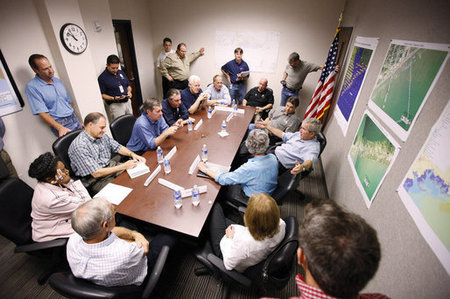 President George W. Bush speaks with state and local officials during a briefing Tuesday, Sept. 16, 2008, at the Galveston emergency operations center.