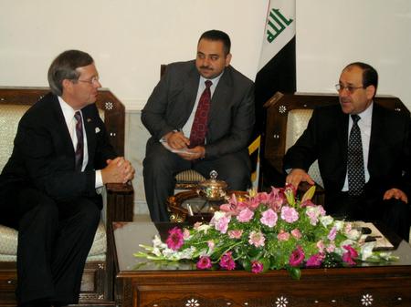 Secretary Leavitt (left); interpreter (middle); Prime Minister of the Republic of Iraq, Nouri Kamel al-Maliki (right)