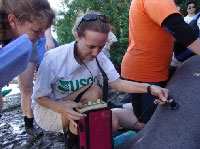 USGS biologist Cathy Beck uses ultrasound to measure manatee fat layers, one indicator of health. - click to enlarge
