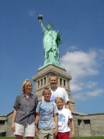 Family in front of the statue of liberty