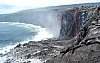 Lava spills over sea cliff at Kamoamoa, Kilauea Volcano, Hawai`i