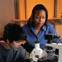 Molecular biologist Marion Sewer and student Houman Khalili investigate the regulation of steroid hormone biosynthesis. Photo at the Georgia Institute of Technology by Gary Meek.