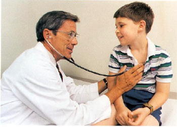 Dr. William Neal examines a pediatric patient