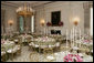 A portrait of President Abraham Lincoln is seen in the State Dining Room of the White House, as tables are set and decorated Tuesday, May 16, 2006, for the official dinner to honor Australian Prime Minister John Howard and his wife Janette Howard. White House photo by Shealah Craighead