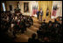 President George W. Bush delivers remarks in the East Room of the White House, Friday, Oct. 7, 2005, where he honors six recipients of the President's Volunteer Service Awards, as part of the celebration of Hispanic Heritage Month.