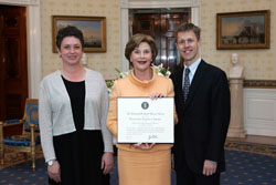 Mrs. Laura Bush poses for a photo with Preserve America Presidential Award winners, Renee Epps, left, and Steven Long May 12, 2008, in the Blue Room at the White House. White House photo by Joyce N. Boghosian