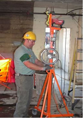 The photo on the left shows a typical method for overhead drilling.  The photo on the right shows the Generation 3 design for the overhead drilling device.