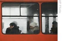 People ride in a unheated tram in effort to save on electric power in Bulgarian capital, Sofia, 8 Jan. 2009
