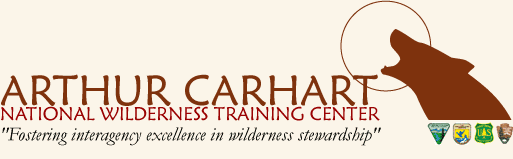 Arthur Carhart National Wilderness Training Center Logo: Wolf howling at moon