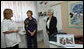 Mrs. Laura Bush and Mrs. Aliza Olmert, spouse of Israeli Prime Minister Ehud Olmert, talk with a staff member during a visit Wednesday, May 14, 2008, to the Tipat Chalav-Gonenim Neighborhood Mother and Child Care Center in Jerusalem. White House photo by Shealah Craighead