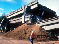 Collapsed (pan caked) double deck Oakland Bay freeway bridge as a result of the 1989 Loma Prieta Earthquake.