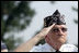 A Korean War veteran salutes during the singing of the National Anthem, Thursday, July 27, 2006 during the 2006 Korean War Veterans Armistice Day Ceremony held at the Korean War Memorial in Washington, D.C. Vice President Dick Cheney honored the veterans in an address and remembered fallen soldiers in a wreath laying ceremony at the memorial.