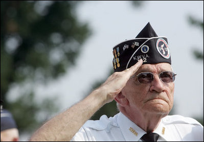 A Korean War veteran salutes during the singing of the National Anthem, Thursday, July 27, 2006 during the 2006 Korean War Veterans Armistice Day Ceremony held at the Korean War Memorial in Washington, D.C. Vice President Dick Cheney honored the veterans in an address and remembered fallen soldiers in a wreath laying ceremony at the memorial.