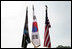 An honor guard composed of Korean War veterans holds flags prior to the start of the 2006 Korean War Veterans Armistice Day Ceremony held at the Korean War Memorial on the National Mall in Washington, D.C., Thursday, July 27, 2006.