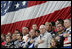 Vice President Dick Cheney joins NASCAR drivers during the playing of the National Anthem Saturday, July 1, 2006, prior to the start of the 2006 Pepsi 400 NASCAR race at Daytona International Speedway in Daytona, Fla.